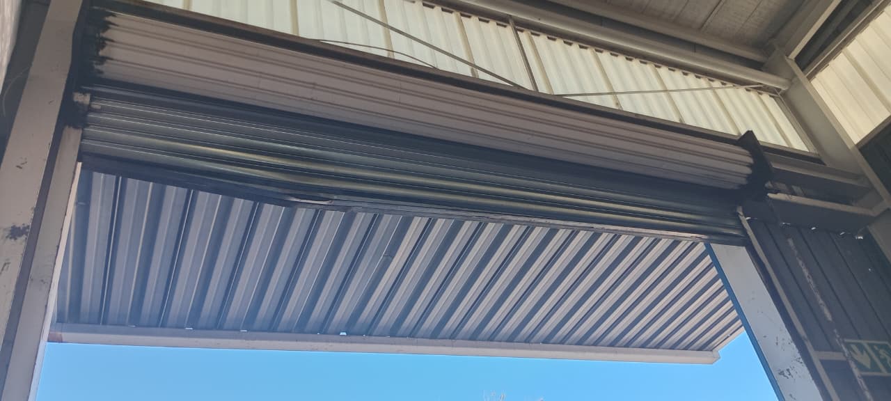 damaged_t_bar_roller_shutter_door_to_be_repaired_Century_team_midrand